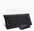 Black and white wireless keyboard and mouse set with USB receiver on desk