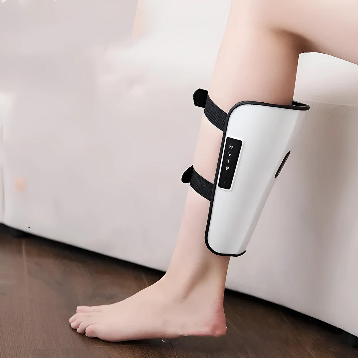 White plastic pulse calf massager unit with mechanical controls for infrared and electrotherapy leg massage.