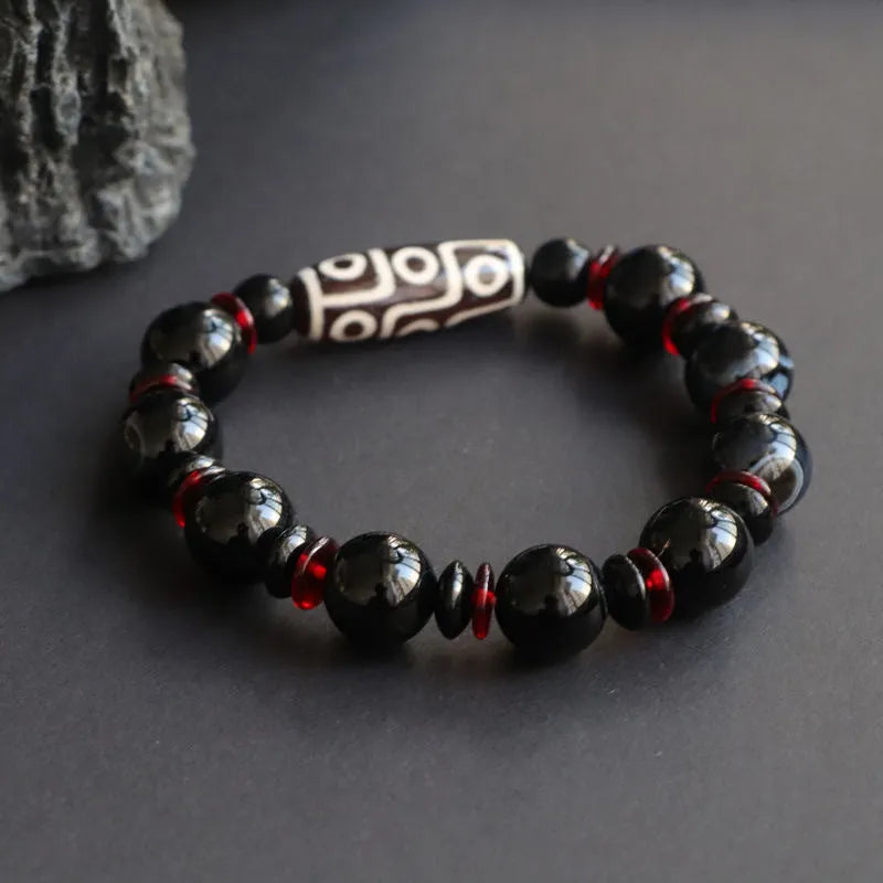 Black agate dzi bead bracelet with 11mm geometric beads in hand-woven unisex design