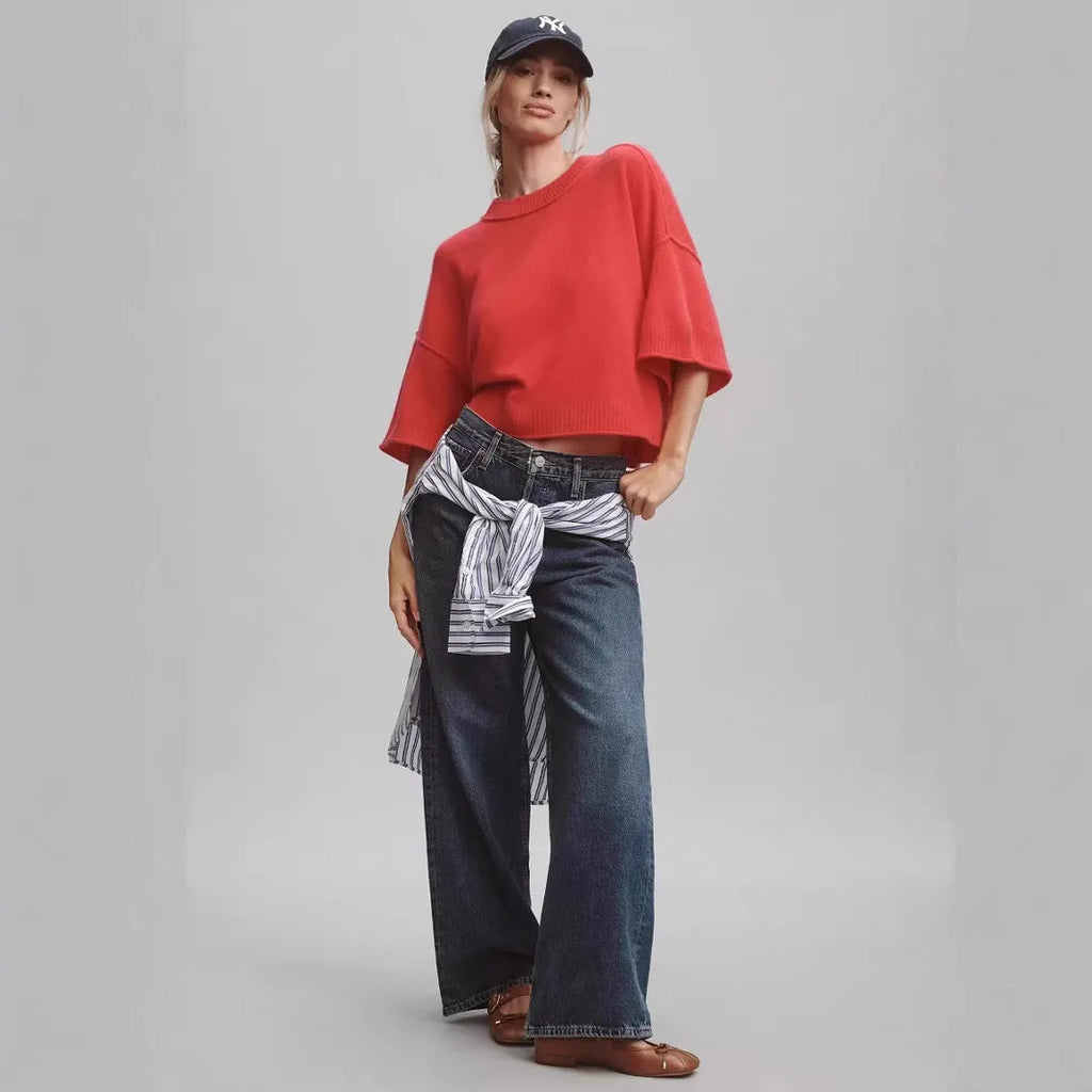 Red cropped viscose t-shirt on a hanger, showing its short length and regular sleeves.