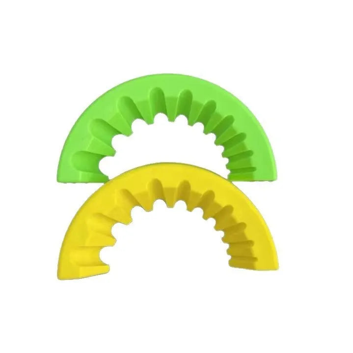 Yellow, green, and black angle grinder grinding bit bracket holders on a workbench.