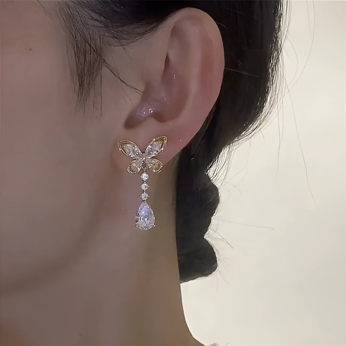Women's platinum bow stud earrings with zinc alloy construction and electroplated finish