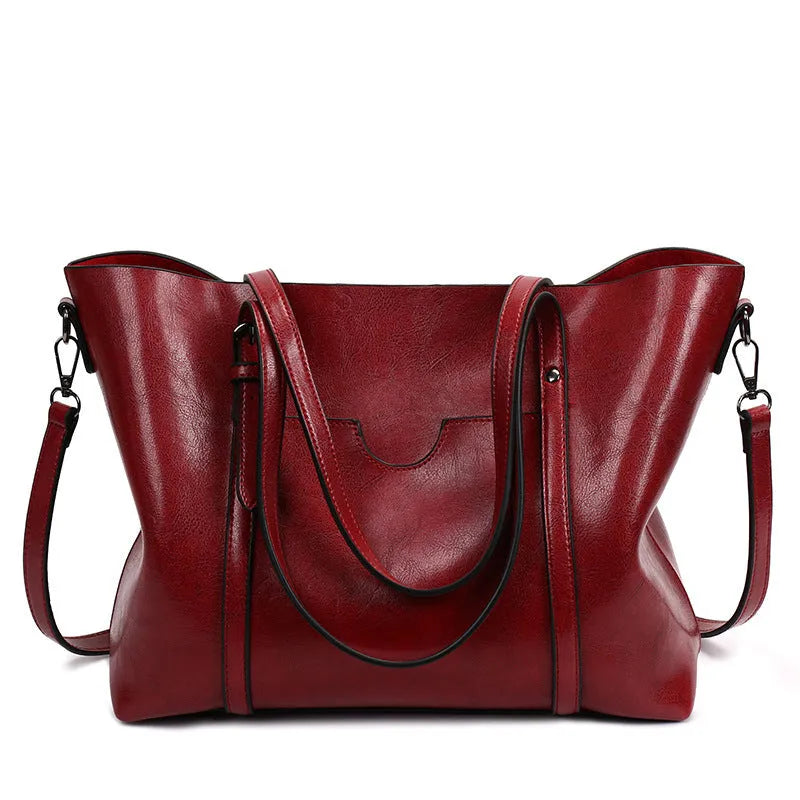 Retro style PU leather messenger bag in light blue, showing large main compartment and shoulder strap.