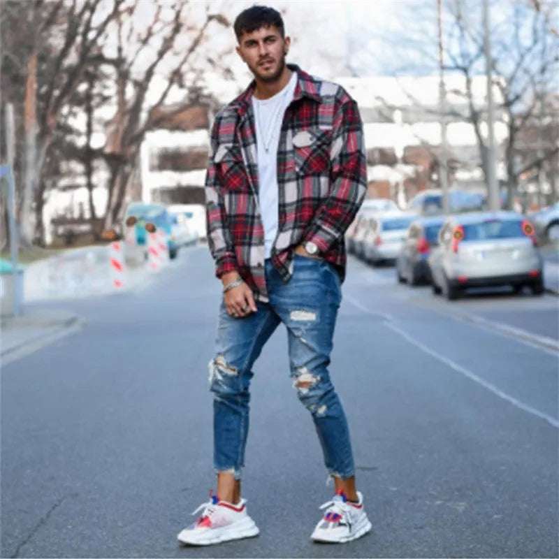 Men's distressed jeans in a deep blue wash on a size chart