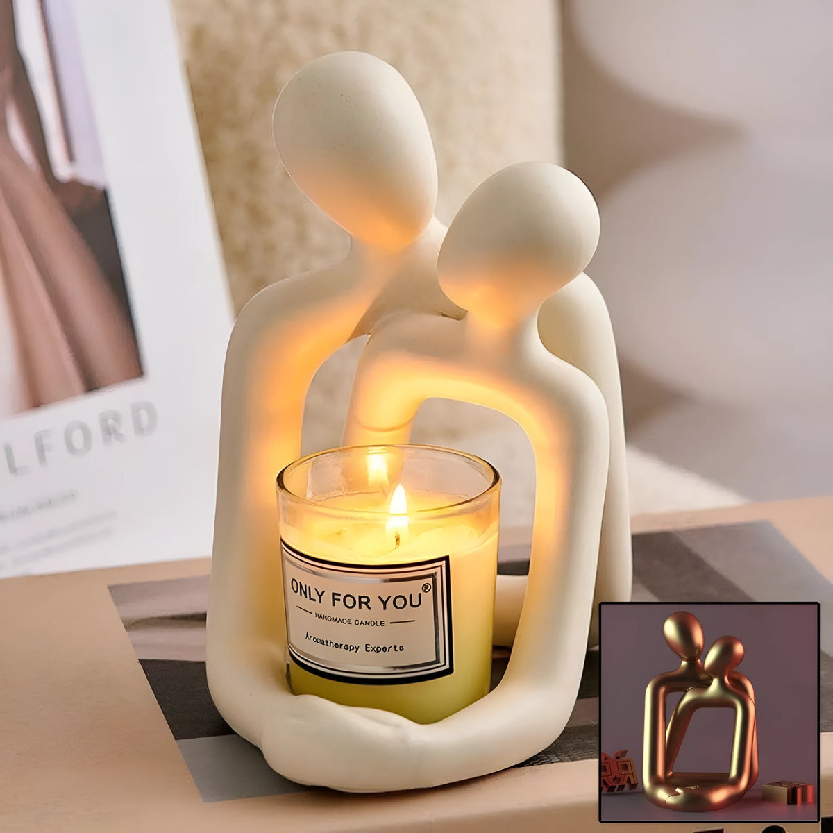 Modern heartwarming couple resin statue in milky white or gold colour on a wooden desk.