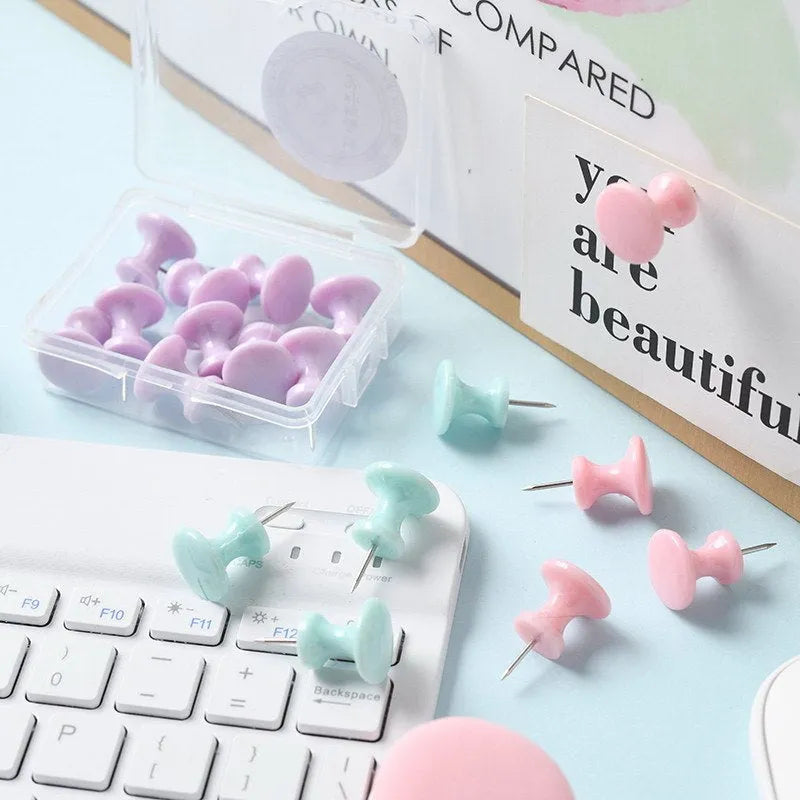 Box of macaron colour plastic push pins showing large and small sizes in cherry blossom pink, mint green, and lavender.