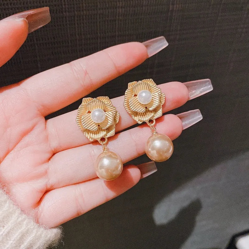 Gold electroplated Hong Kong style stud earrings with needle rose pearl and opal stone design.