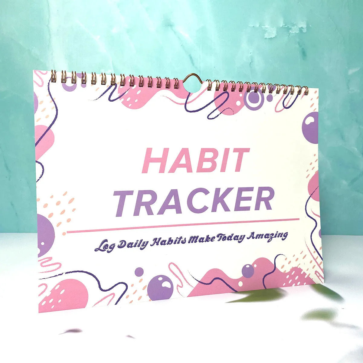 Self-discipline habit tracking notebook showing 12 internal pages with A4 21x28cm dimensions