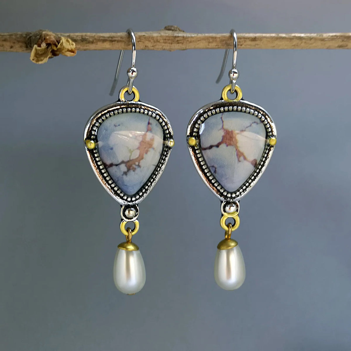 Retro blue bohemian drop earrings with lavender turquoise and pearl elements on geometric metal setting