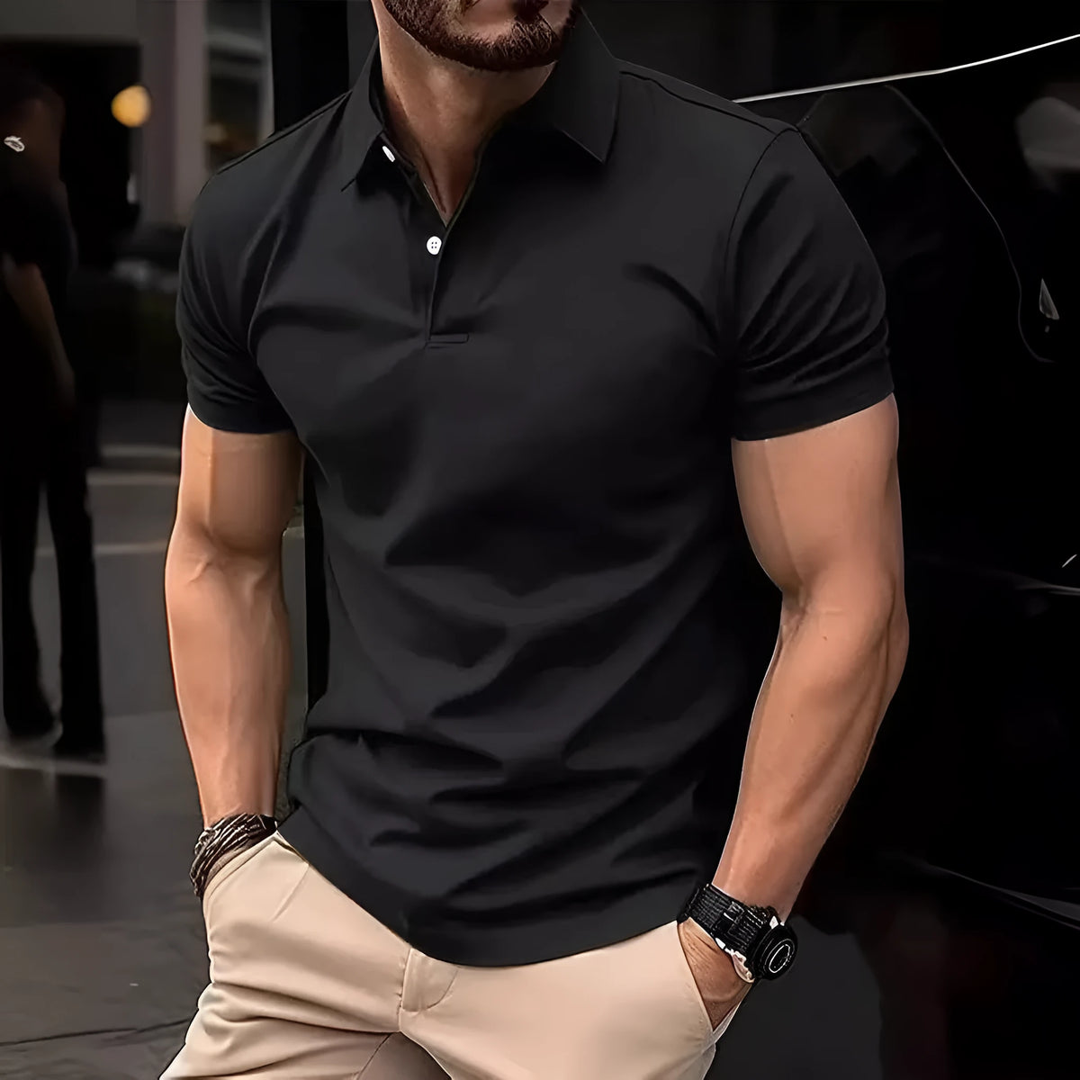 Man wearing a slim-fit solid colour short sleeve button shirt in a casual setting.