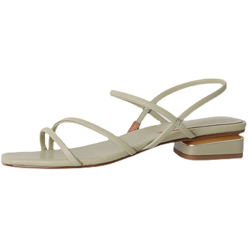 Women's green flat Roman sandals with square toe and microfiber straps on a white background.