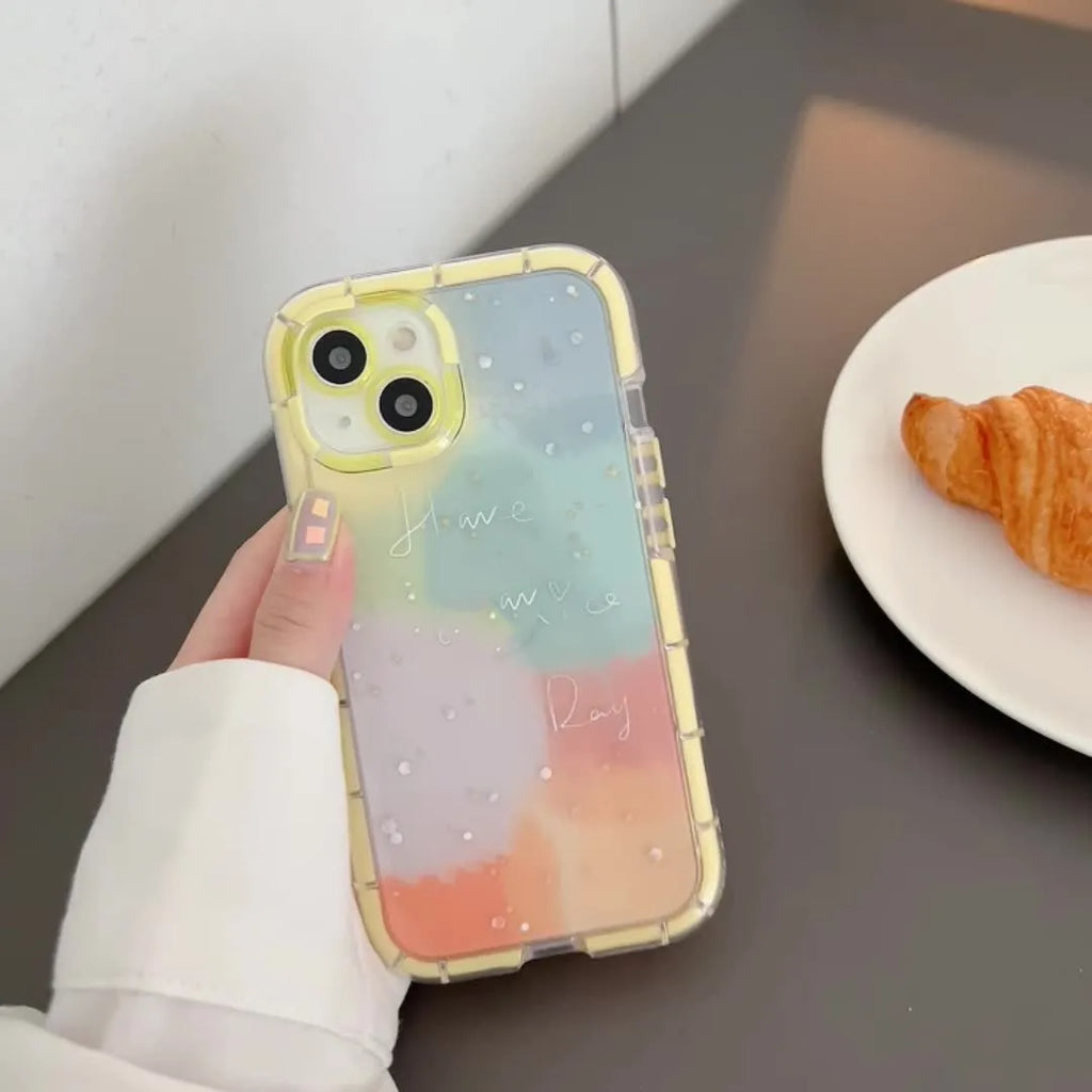 Minimalist silicone phone case for iPhone 14 with a contrasting yellow edge on a white background.