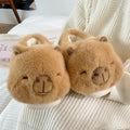 Light brown women's winter slippers with plush upper, artificial wool lining, and slip-on design