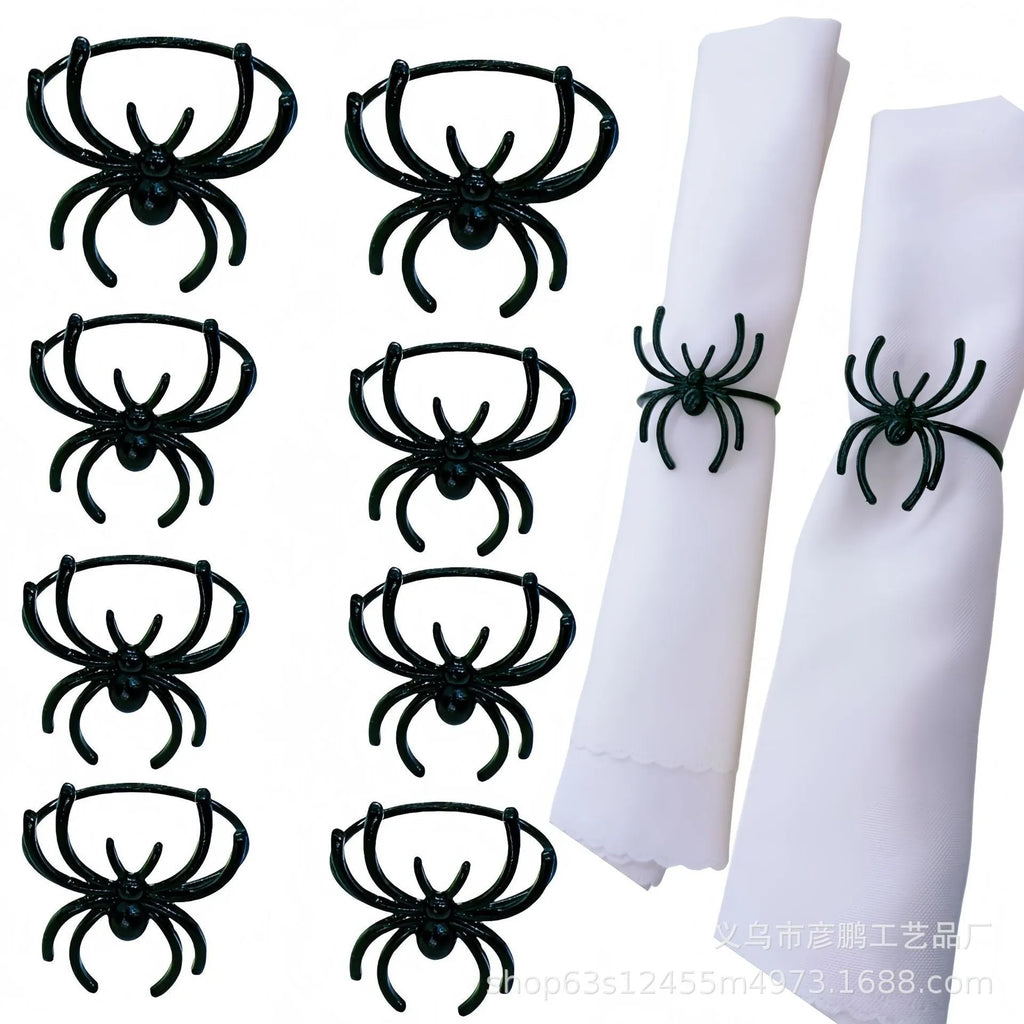 Set of six black spider patterned alloy napkin rings for Halloween table decoration