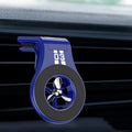 Black magnetic car phone holder with fragrance slice mounted on a car air vent