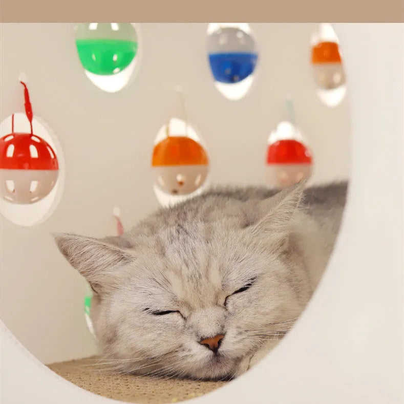 Plastic cat scratch board integrated with nest area and tunnel containing bell balls