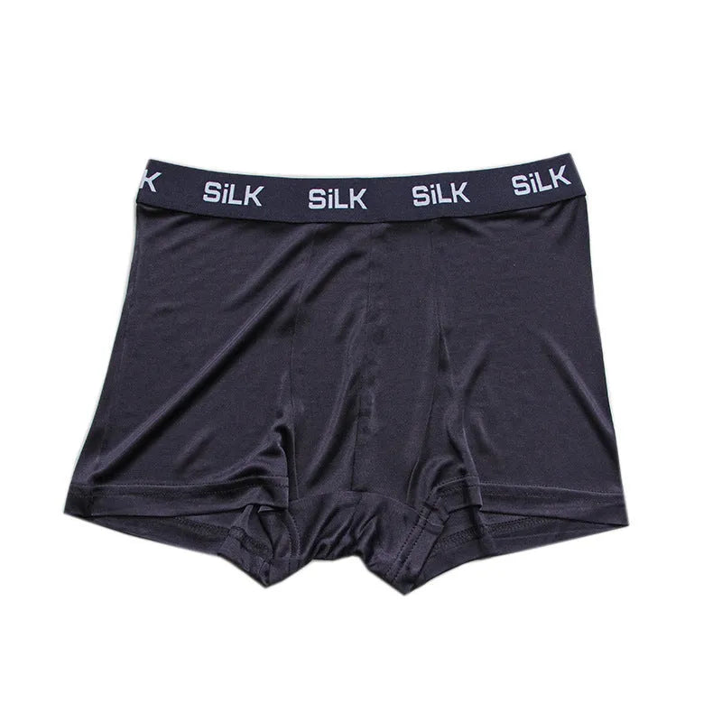 Men's loose silk shorts in navy blue, silver gray, and skin color with mid-waist design