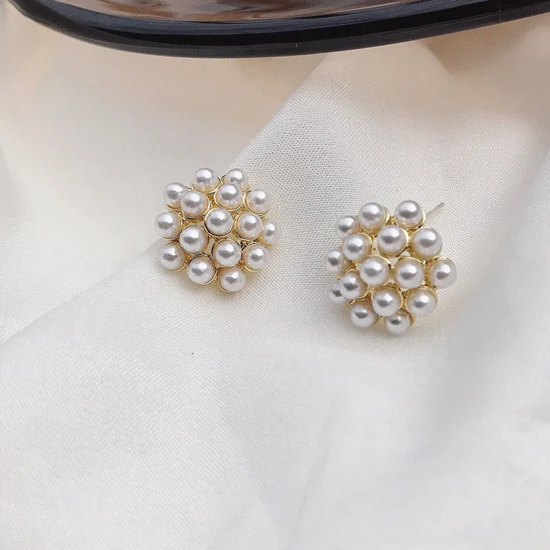 Korean style pineapple and starfish pearl design alloy earrings with electroplated gold, silver, pearl flower, and starfish pearl finishes.