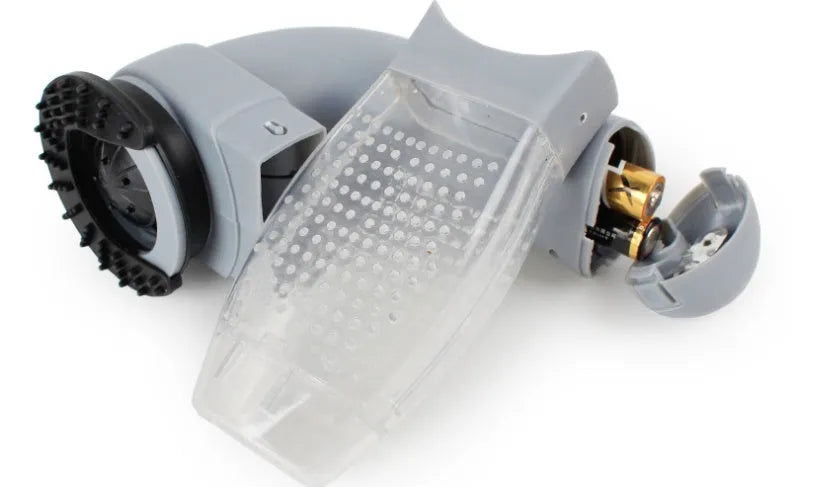 Grey portable electric pet hair vacuum cleaner with grooming brush.