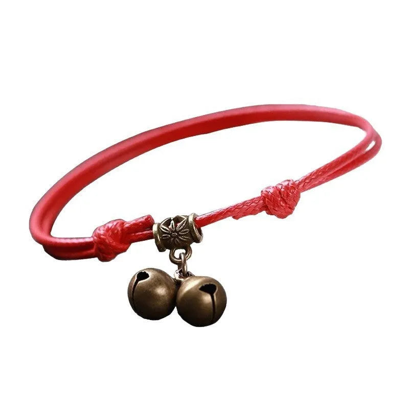 Nylon dog collar with brass bell shown in black rope colour, suitable for small to medium dogs.