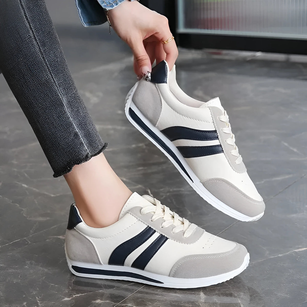 Red and blue low-top lace-up casual sneakers with a PU mesh upper and rubber sole.