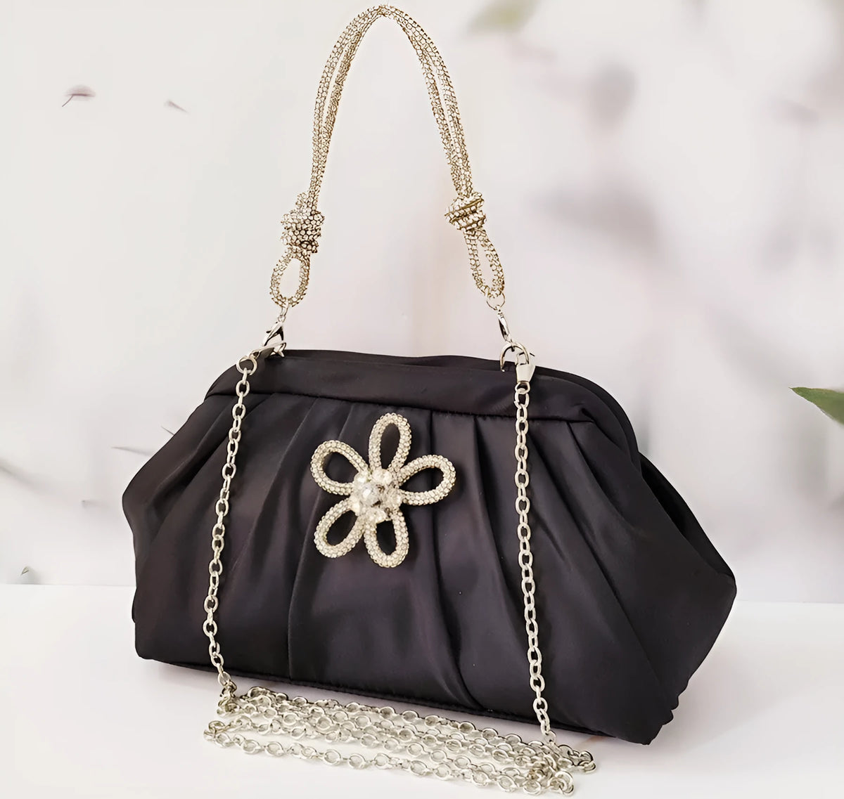 Women's soft polyester messenger bag with diamond quilting and chain strap in black colour