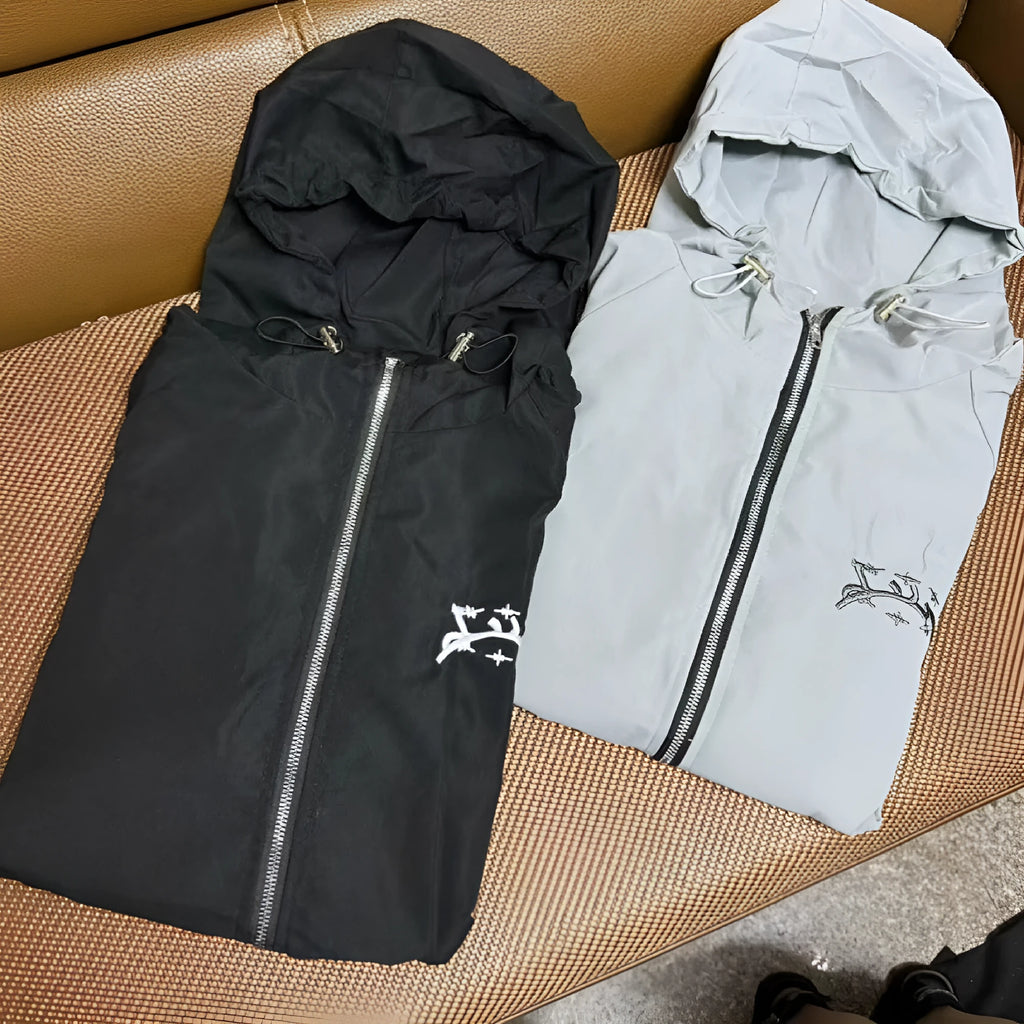 Grey men's hooded loose-fit sunscreen jacket in British style on a hanger