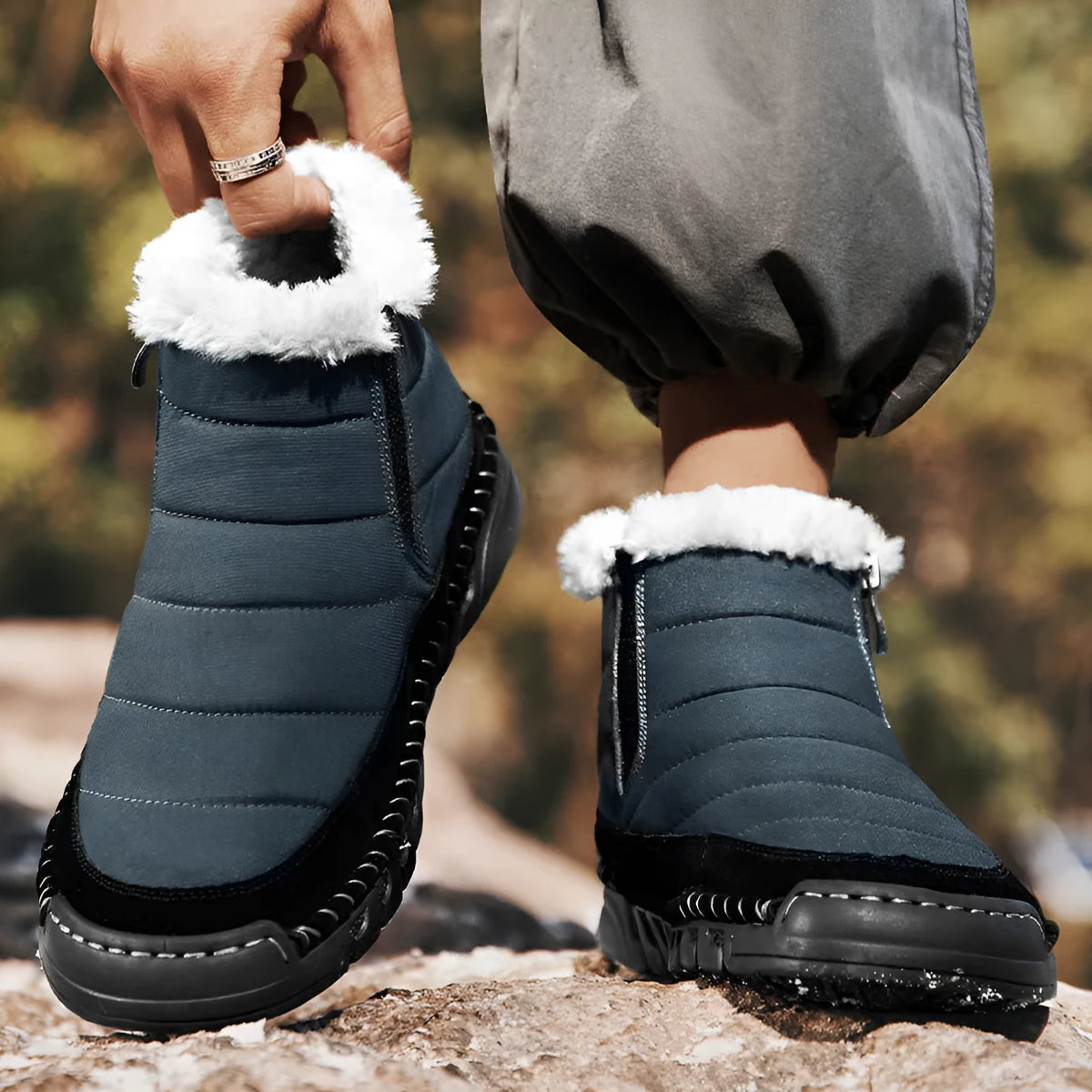 Men's plus size snow boot in a solid colour with a round toe, flat heel, and non-slip rubber sole.