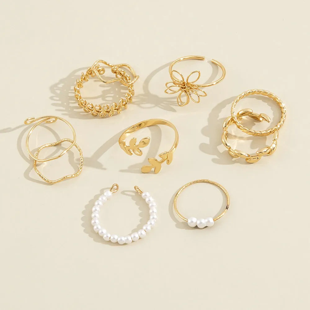 Gold colour openwork flower set ring with detailed floral design and glossy electroplated finish