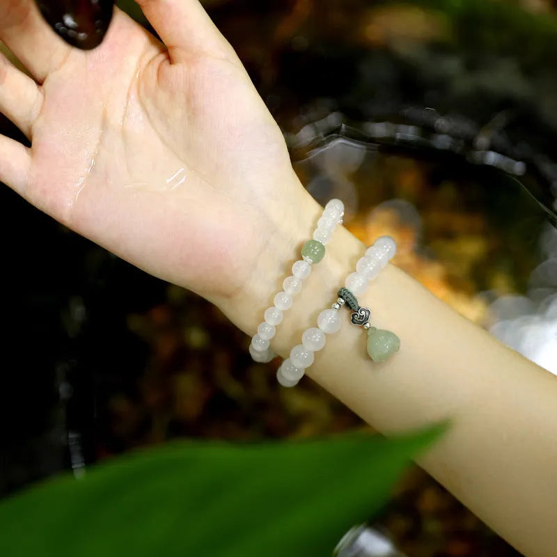 Women's S925 silver bracelet with white agate and Hetian jade stones in geometric lotus pattern