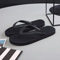 Rubber flip-flops with non-slip, deodorant soles in green, red, blue, or black with a fish logo.