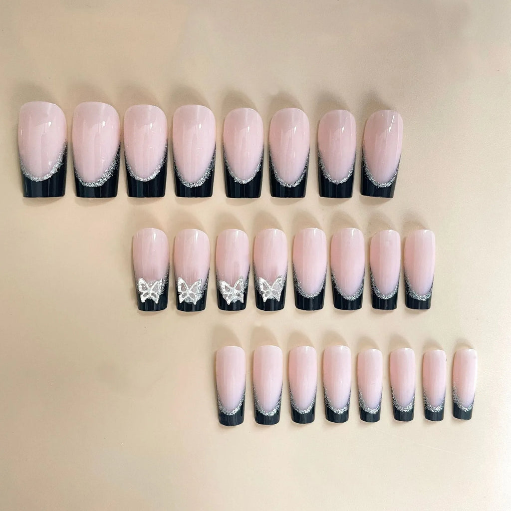 Black French style false nails with glittering butterfly patterns in medium length wearable armour design