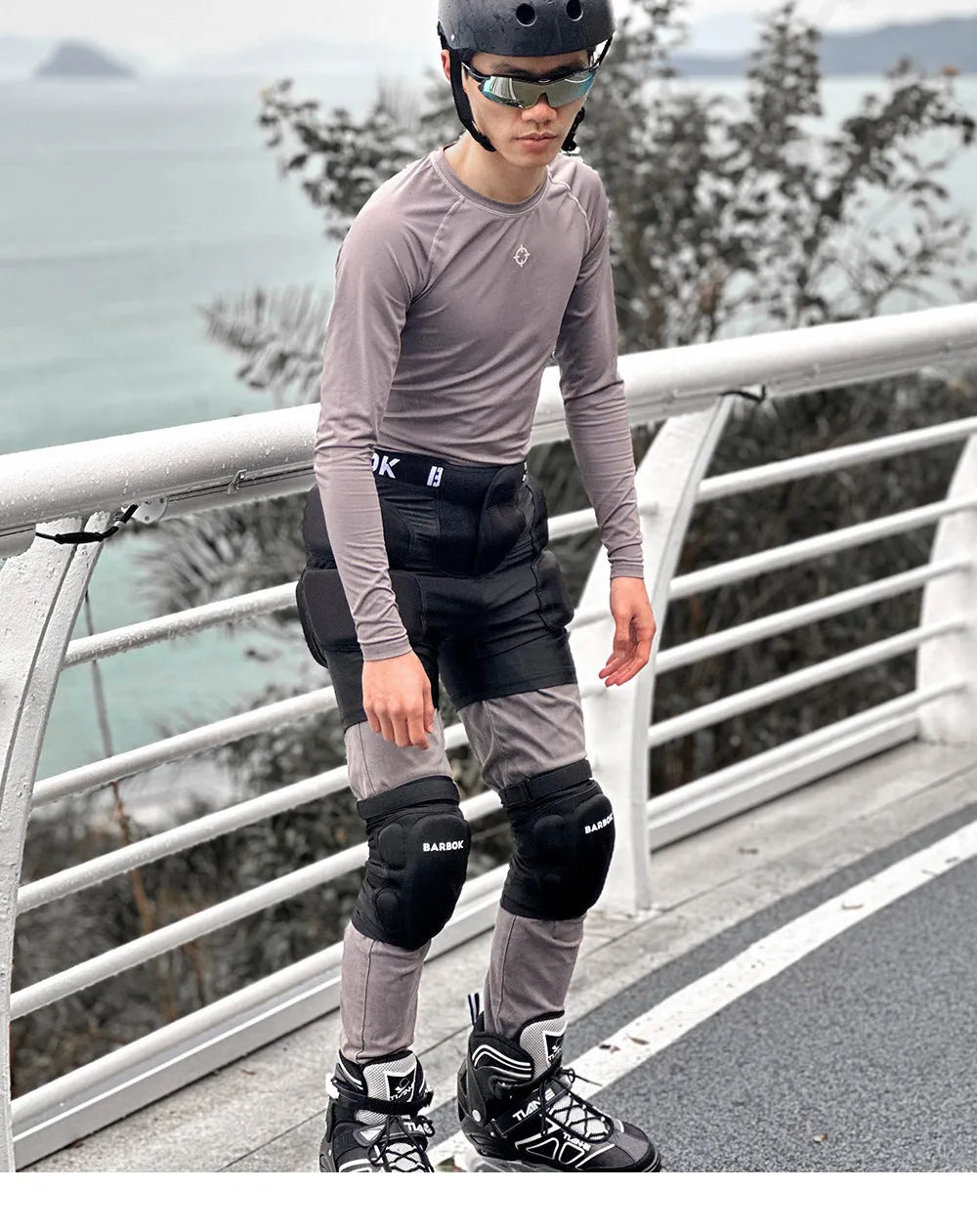 Black BA103 protective hip pad with elastic leg straps for roller skating and skateboarding safety.