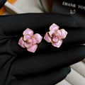 Gold plated purple oil-spot glaze flower stud earrings on copper base with floral design