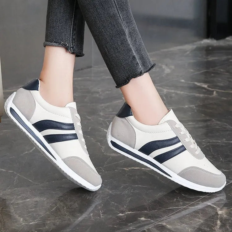 Red and blue low-top lace-up casual sneakers with a PU mesh upper and rubber sole.