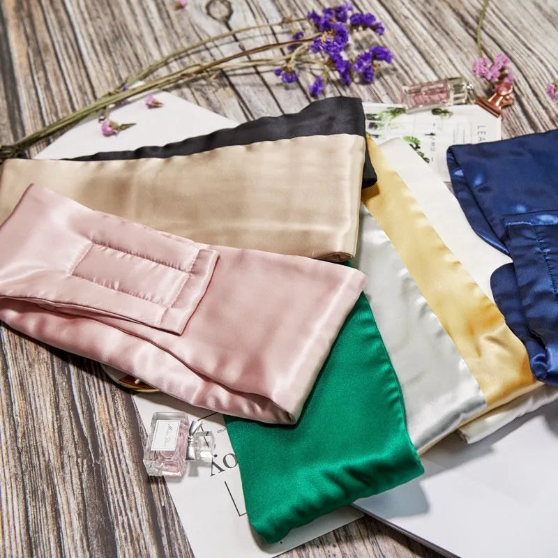 Mulberry silk sleep eye mask shown in one of seven colour options including champagne gold, navy blue, or black.