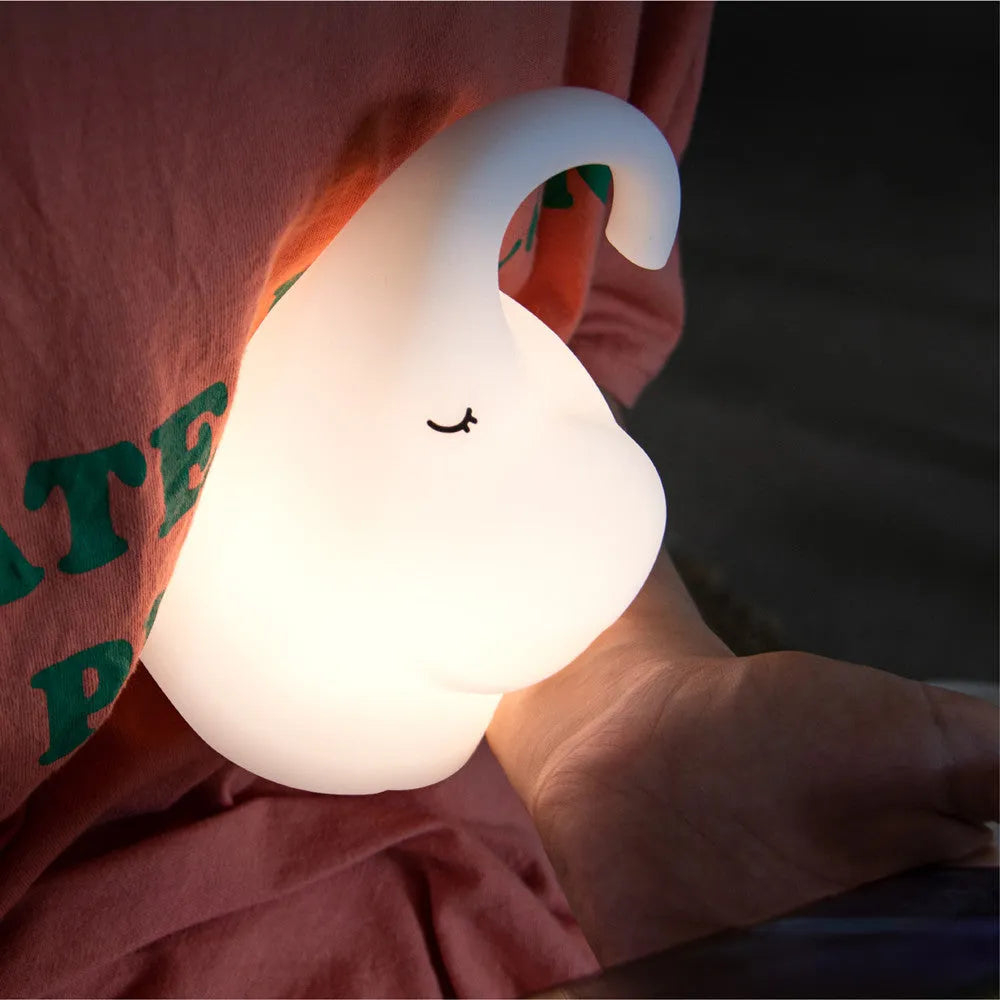 Elephant-shaped silicone night light with warm white LED glow for bedroom bedside use