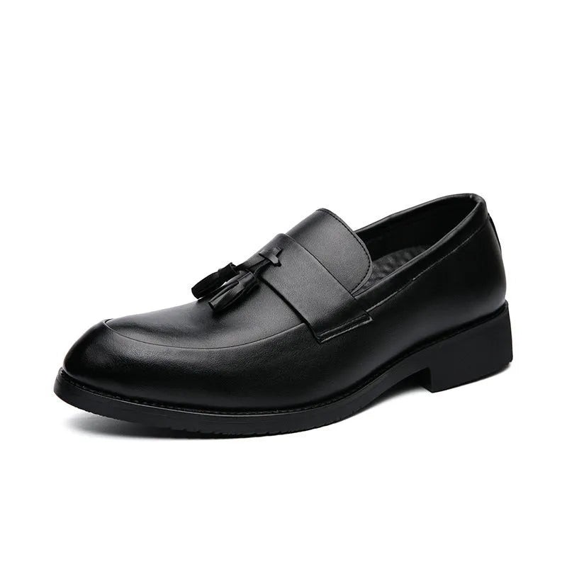 Men's black business casual slip-on shoes with tassel detail and rubber sole