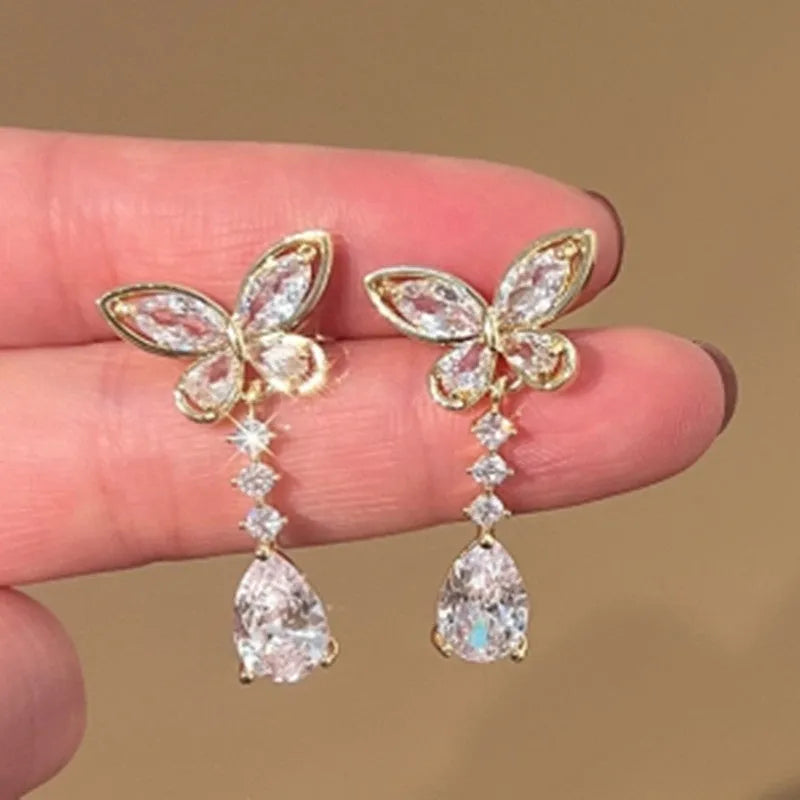Women's platinum bow stud earrings with zinc alloy construction and electroplated finish