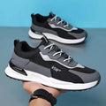Men's colour block mesh sneakers in black, grey, or white with lace-up design and round toe.