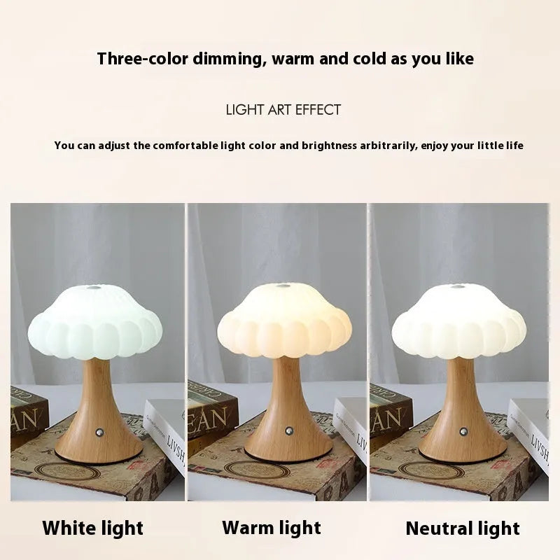 Wood grain coloured mushroom-shaped touch night lamp on a wooden table.
