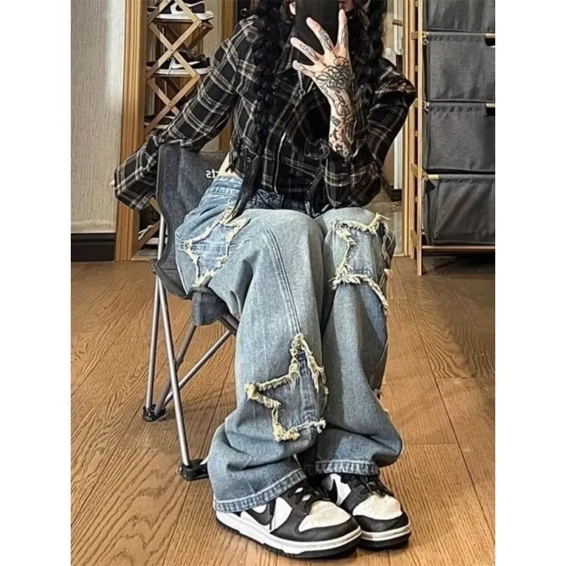 Blue high-waisted wide-leg denim jeans with a straight-leg cut on a model