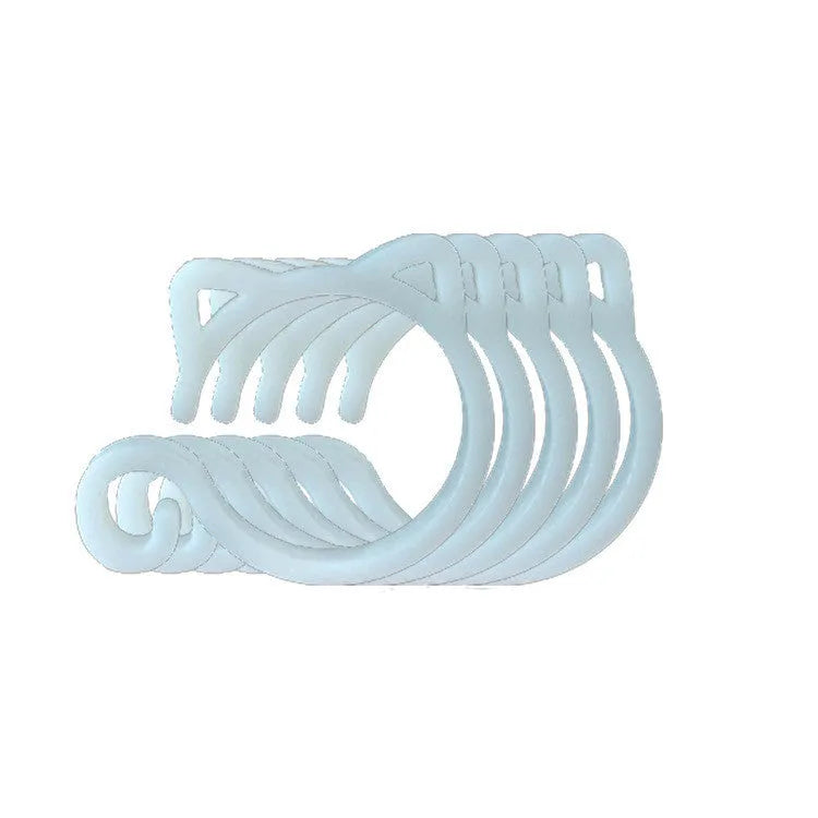 Colourful plastic cat-shaped plant clip for gardening support on a green leaf.