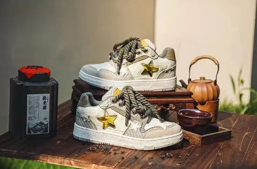 Green low-top casual shoes with star pattern stitching and white rubber sole.