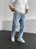 Men's blue straight-leg denim jeans with loose wide-leg cut and zip fly