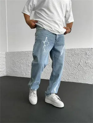 Men's blue straight-leg denim jeans with loose wide-leg cut and zip fly