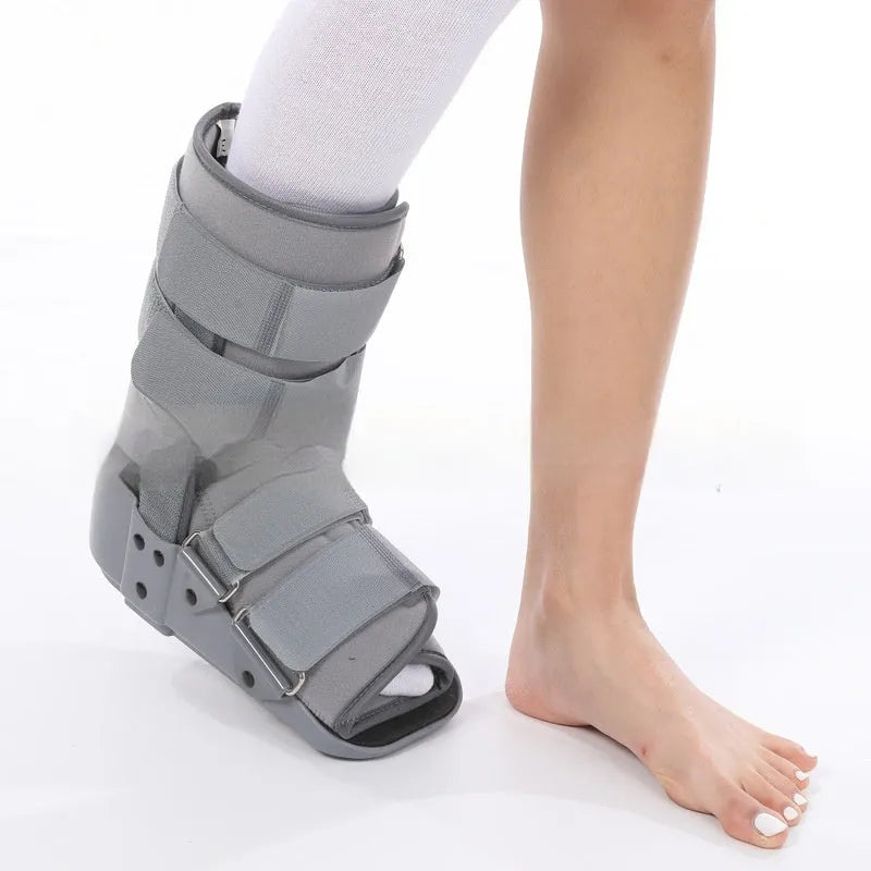Grey and black Achilles tendon rehabilitation fixed support walking boot with adjustable straps.