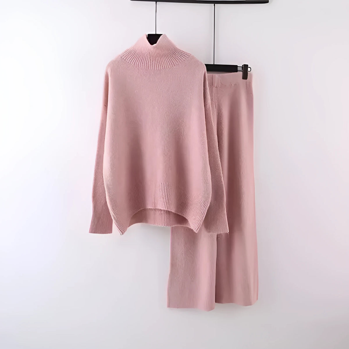 Women's milky white acrylic fibre sweater and wide-leg trousers two-piece set on a hanger.