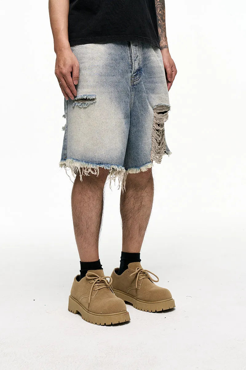 Light blue retro washed men's baggy denim shorts on a mid-waist mannequin.