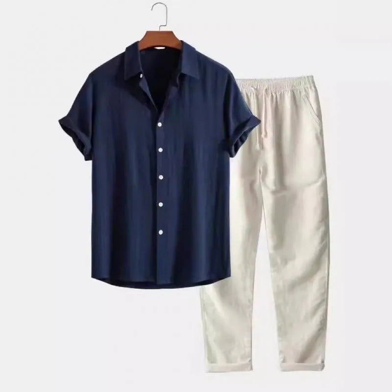 Man wearing a loose-fit short sleeve shirt and matching trousers from a casual linen-look two-piece set.
